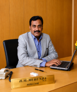 Director of one of the best MBA colleges in Bangalore guiding students towards academic and professional success.